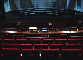 Rows of red seats in a theater